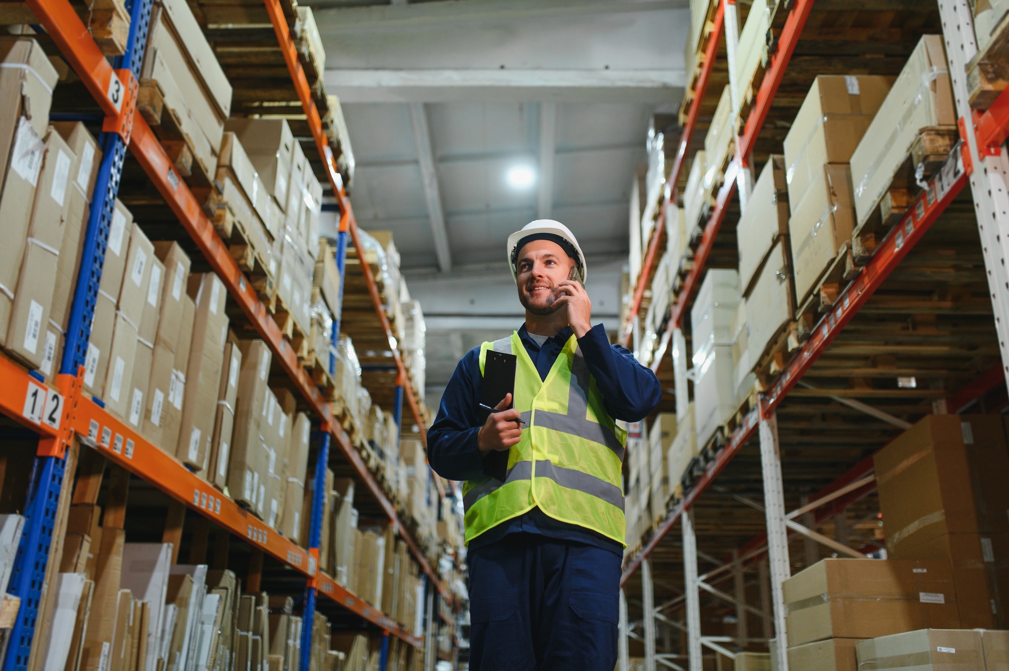 Warehouse, shipping and man walking in a distribution, freight and supply chain company.