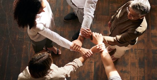 Teamwork, strong and people hands stacked for support, collaboration or team building power in busi